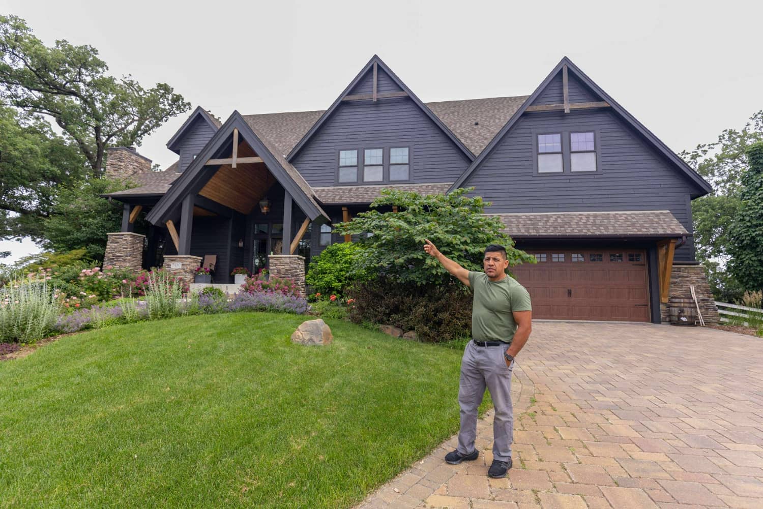 cesar infront of painted home